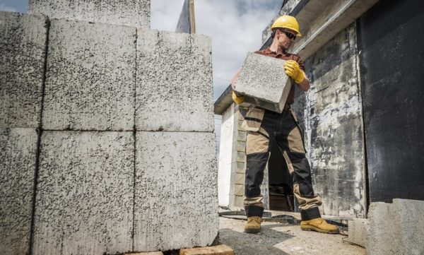 construction worker moving building