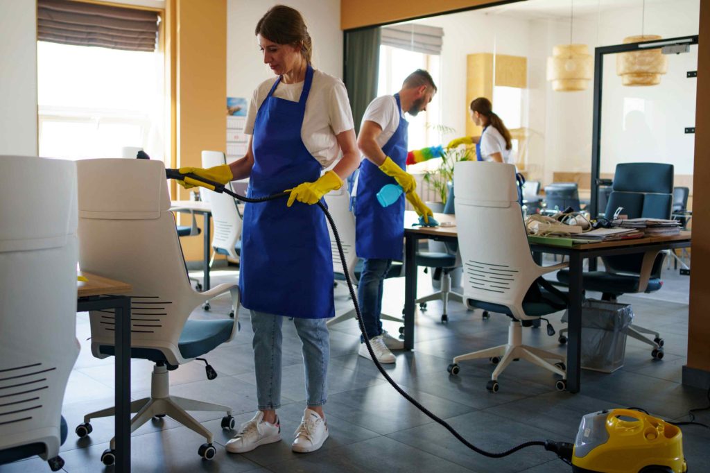 person using vacuum cleaner office