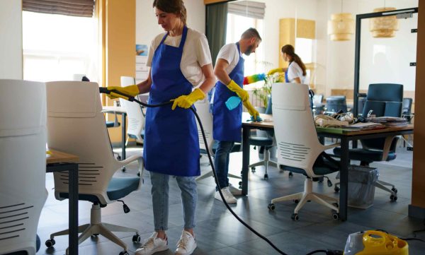 person using vacuum cleaner office